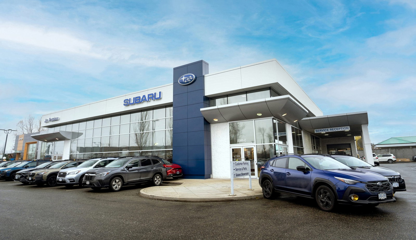 New and used vehicles on a Red Deer dealership lot, tinted and paint-protected by Lightning Tint